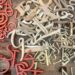 a wooden table topped with lots of different types of scissors